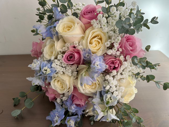 Wedding bouquet with pink and blue delphium